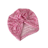 Pink patterned headscarf on a white background