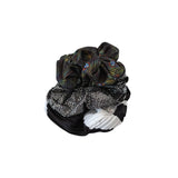 Set of three decorative hair scrunchies with peacock feather pattern on a white background