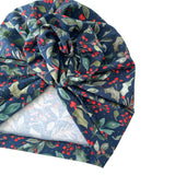 Navy blue headscarf with red berries and green leaves on a white background