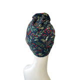 winter patterned headscarf on a mannequin head against a white background