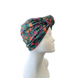 Floral headscarf on a mannequin head against a white background