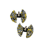 Two floral-patterned  clips on a white background