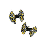 Two floral bow clips on a white background