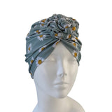 Floral patterned headscarf on a mannequin head against a white background ireland