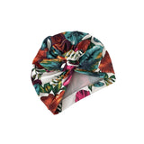 Colorful tropical leaf patterned headscarf on a white background