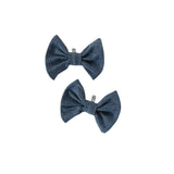 Two grey bow ties on a white background