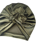 Green satin turban with a knot on a white background