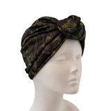 Black patterned headscarf on a mannequin head against a white background ireland