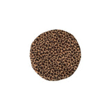 Round leopard print coaster on a white background