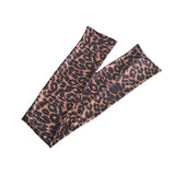 A pair of leopard print arm warmers or sleeves with a brown, black, and beige animal pattern, displayed on a solid white background.