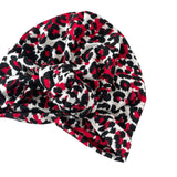 Leopard print headscarf with a knot on a white background