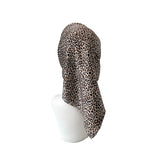 Leopard print hood on a mannequin head against a white background