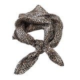 Leopard print scarf tied in a knot on a white background