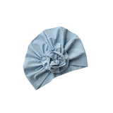 Light blue headscarf with a flower on a white background