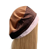 Brown and beige headscarf on a mannequin head with blonde hair against a white background ireland