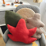 Decorative pillows in various colors on a chair with a neutral background