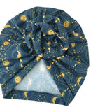 Blue headscarf with moon and star pattern on a white background