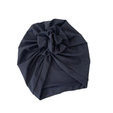 Navy blue turban on a white background