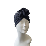 blue headscarf on a mannequin head against a white background