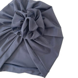 navy headscarf with a large bow on a white background