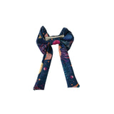 Colorful scarf with space-themed design on a white background