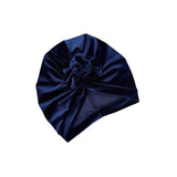 Navy blue turban with a knot on a white background
