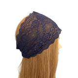 Navy lace headband on a mannequin head with blonde hair against a white background