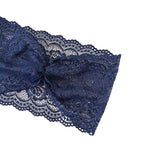 Navy blue lace fabric on a white background