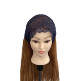 Mannequin head with brown hair wearing a navy blue lace headband on a white background