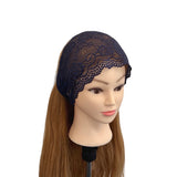 Mannequin head with a dark blue lace headband on a white background