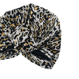 Leopard print headscarf with a knot on a white background