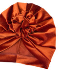 Brown velvet turban on a white background