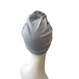 blue headscarf on a mannequin head against a white background