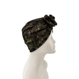 Black headscarf with feather pattern on a mannequin head against a white background