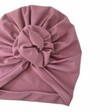 Pink turban on a white background