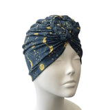 Blue patterned headscarf on a mannequin head against a white background