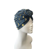 Blue patterned headscarf on a mannequin head against a white background