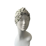 Headscarf on a mannequin head against a white background