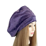 Purple velvet headscarf on a mannequin head with long hair against a white background ireland
