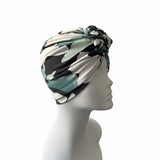 Turban with a geometric pattern on a mannequin head against a white background