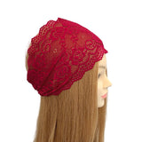 Red lace headband on a mannequin head with long hair against a white background