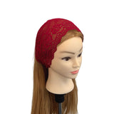 Red lace headband on a mannequin head with long brown hair against a white background