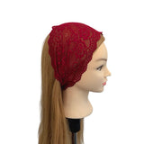 Red lace headband on a mannequin head against a white background
