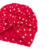 Red headband with white polka dots on a white background