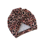 Leopard print headscarf on a white background