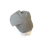 Gray beanie on a mannequin head against a white background