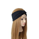 A black twisted headband displayed on a mannequin head with long straight light brown hair, set against a plain white background.