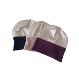 Two satin headbands with color-blocked ends on a white background