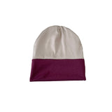 Two-toned beanie with white top and purple bottom on a white background