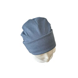 Blue beanie on a mannequin head against a white background